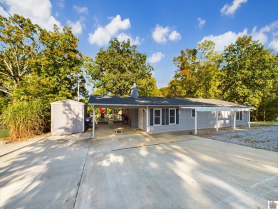 Welcome to the serenity of waterfront living  This stunning - Lake Home For Sale in Benton, Kentucky