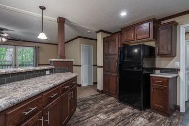 Enjoy easy country living nestled among the trees on 1.5 wooded - photo 11