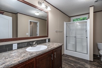Enjoy easy country living nestled among the trees on 1.5 wooded - photo 17