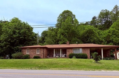 PRIME LOCATION defines this 3-bedroom, 2-bathroom brick ranch - photo 1