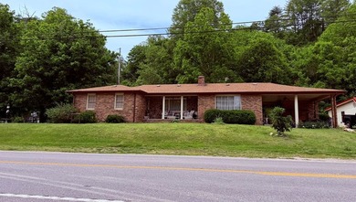 PRIME LOCATION defines this 3-bedroom, 2-bathroom brick ranch - photo 3