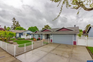 Ready to enjoy this perfectly manicured front yard & beautiful