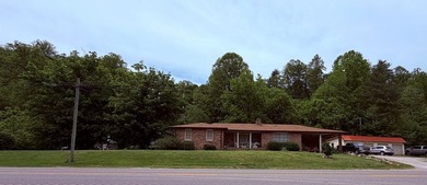 PRIME LOCATION defines this 3-bedroom, 2-bathroom brick ranch - photo 4