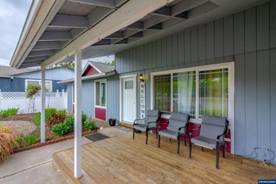 Ready to enjoy this perfectly manicured front yard & beautiful