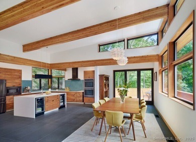 This exquisite Frank Lloyd Wright Usonian-inspired lakefront - photo 13