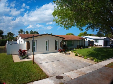 This beautifully maintained 4/2 pool home offers just under 2 - photo 1