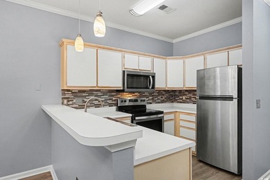 This welcoming 2-bedroom, 2-bath first-floor end-unit condo sits - photo 6
