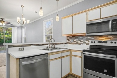 This welcoming 2-bedroom, 2-bath first-floor end-unit condo sits - photo 7