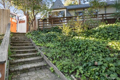 Perched above the street, this charming alpine-style cabin - photo 13