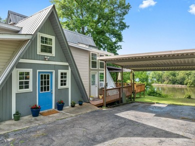 Perched atop a scenic hill with breathtaking water views, this - photo 1