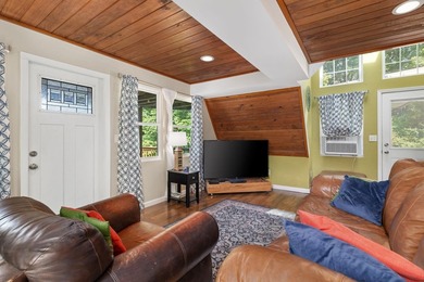 Perched atop a scenic hill with breathtaking water views, this - photo 3