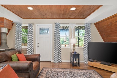 Perched atop a scenic hill with breathtaking water views, this - photo 4