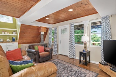 Perched atop a scenic hill with breathtaking water views, this - photo 5