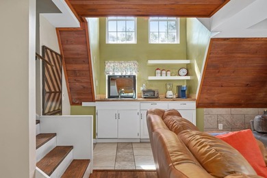 Perched atop a scenic hill with breathtaking water views, this - photo 6