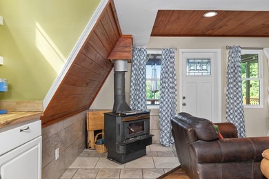 Perched atop a scenic hill with breathtaking water views, this - photo 7