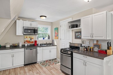Perched atop a scenic hill with breathtaking water views, this - photo 9