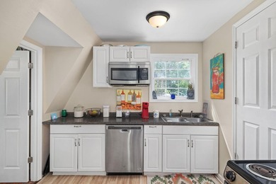 Perched atop a scenic hill with breathtaking water views, this - photo 10