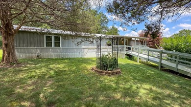 23-acre country property in the Missouri Ozarks featuring a - photo 3