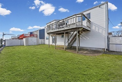 Waterfront high ranch offering 4 bedrooms and 2 full baths, set - photo 24