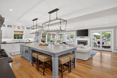 Where home and horizon merge, this waterfront estate on - photo 12