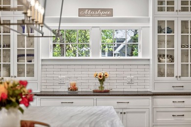 Where home and horizon merge, this waterfront estate on - photo 18