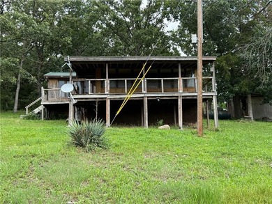 Nestled just minutes from the boat ramp near the beloved Lake of - photo 1