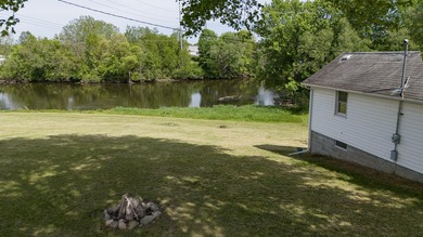 Tucked along the scenic St. Joseph River in Three Rivers, this - photo 3