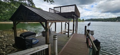 Welcoming covered front porch w/ composite decking & lake views - photo 2