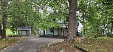 Welcoming covered front porch w/ composite decking & lake views - photo 7