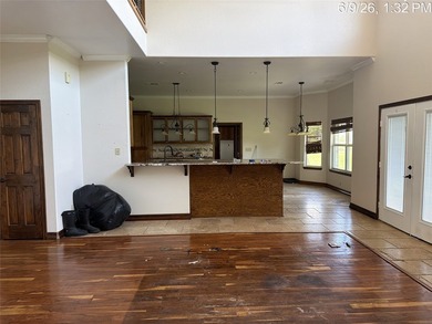 Set on 1.48 wooded acres along Lake Limestone, this custom stone - photo 8