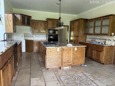 Set on 1.48 wooded acres along Lake Limestone, this custom stone - photo 10