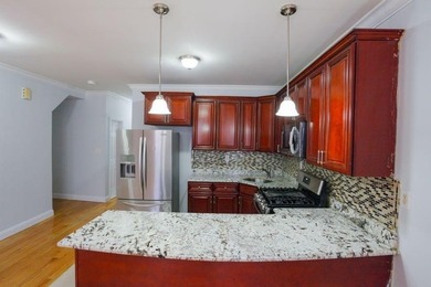 This well-maintained legal two-family, 6 bedroom, 3 bath brick - photo 5
