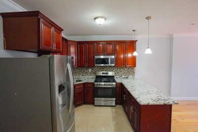 This well-maintained legal two-family, 6 bedroom, 3 bath brick - photo 6