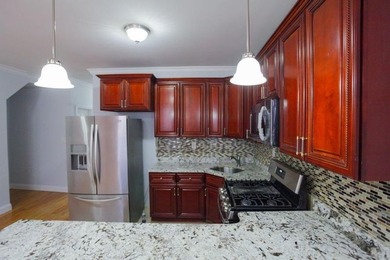 This well-maintained legal two-family, 6 bedroom, 3 bath brick - photo 7