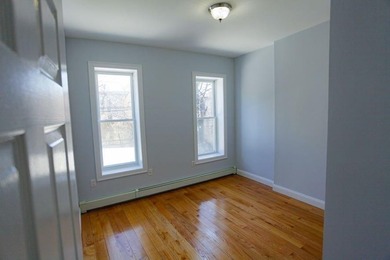 This well-maintained legal two-family, 6 bedroom, 3 bath brick - photo 8