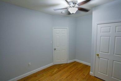 This well-maintained legal two-family, 6 bedroom, 3 bath brick - photo 9