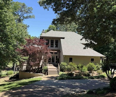 WONDERFUL HOME NESTLED IN THE WOODS ON ONE OF THE FINEST GOLF - photo 1