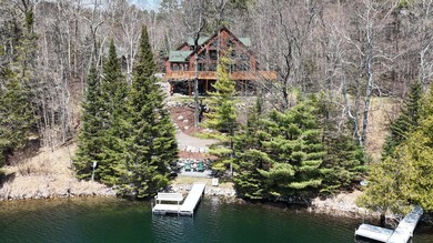 Set on 219' of shoreline along the striking blue-green waters of - photo 2