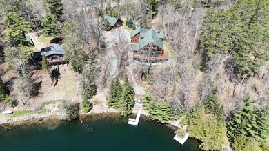 Set on 219' of shoreline along the striking blue-green waters of - photo 3