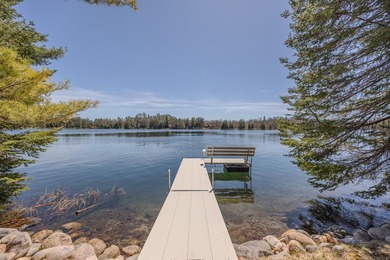 Set on 219' of shoreline along the striking blue-green waters of - photo 6