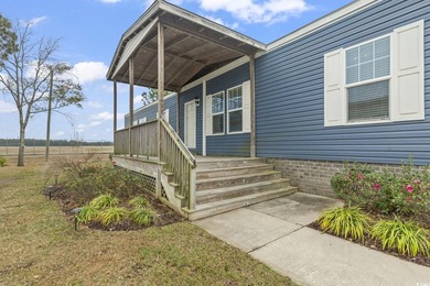 Welcome to Market Village! This welcoming 3-bedroom, 2-bath - photo 1