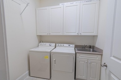 Located in the prestigious gated community of The Bluffs on the - photo 21