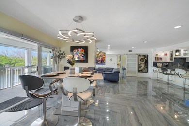 One of the finest three-bedroom waterfront residences in - photo 18