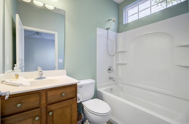 Pond living in this spacious, turn-key home in Del Webb Cane Bay