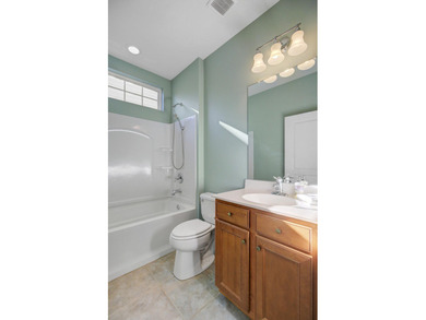 Pond living in this spacious, turn-key home in Del Webb Cane Bay