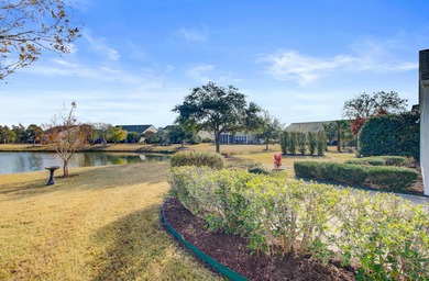 Pond living in this spacious, turn-key home in Del Webb Cane Bay