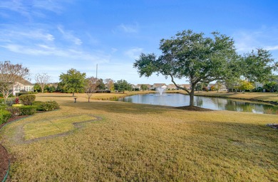 Pond living in this spacious, turn-key home in Del Webb Cane Bay