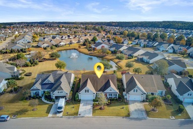 Pond living in this spacious, turn-key home in Del Webb Cane Bay