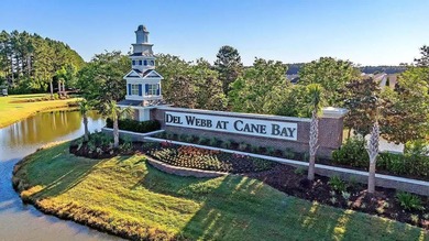 Pond living in this spacious, turn-key home in Del Webb Cane Bay