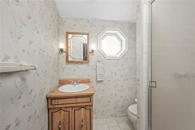 This spacious 3-story home in Gerritsen Beach sits on a double - photo 24